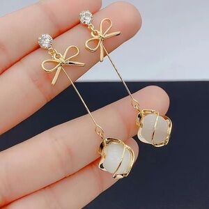 Elegant Minimalist Long Earrings with Glass Beads and Bow Design. Drop Earrings